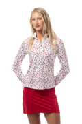 Woman wearing a white blouse with red Canadian Flag pattern and a red skirt on a white background.